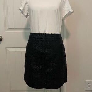 Limited size 8 skirt black. Side zipper and eyelet closure. Neat texture.